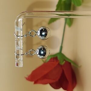 Silver color dangle ball earrings